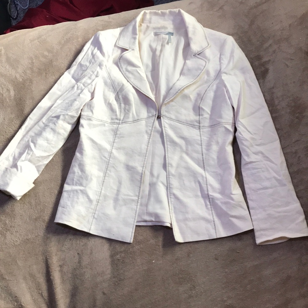 Cream colored blazer with brown stitching